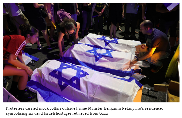 Protestors carry mock coffin